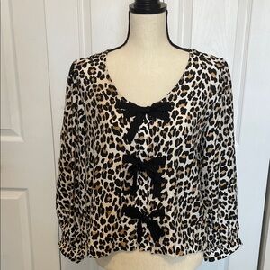 NWT JODIFL LEOPARD LONG SLEEVE PRINT BOUSR WITH BLACK BOW ACCENTS. SIZE SMALL.